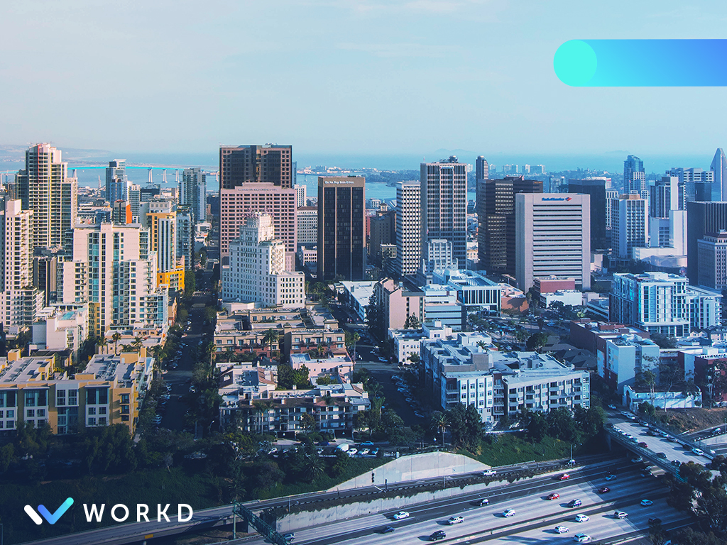 Picture of San Diego skyline with workd overlay and logo