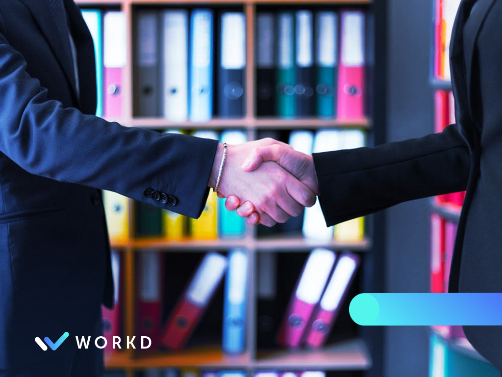 Two people networking and shaking hands