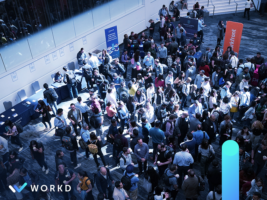 Large crowd of people at a conference. The workd logo is in the lower left corner