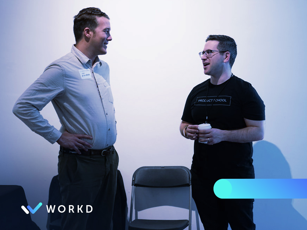 Two men networking at a conference
