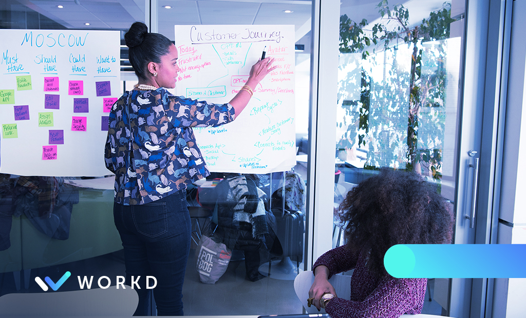 One woman receiving sales training from another woman.